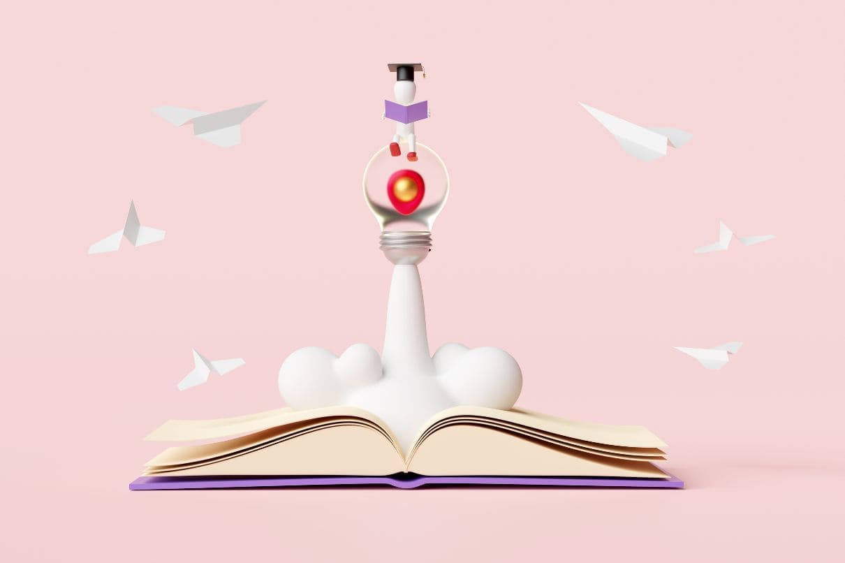 An open book with a light bulb on top, symbolizing knowledge and inspiration.